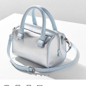 Urban Outfitters mini silver duffle bag